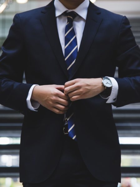 Business Man in suit looking to combat business failure